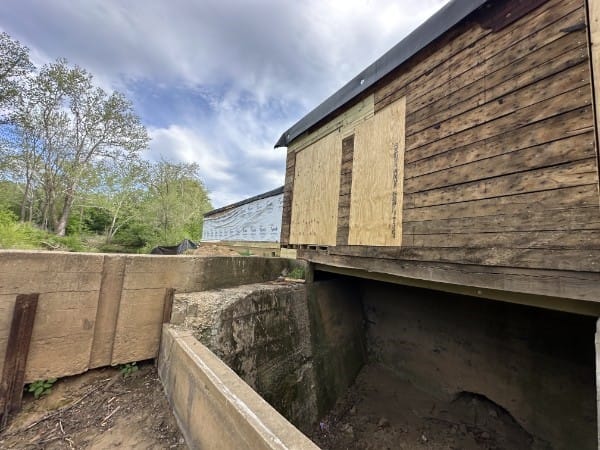 exterior of boarded-up mill